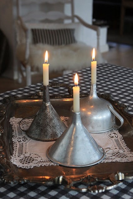 upcycle old funnels as candle holders