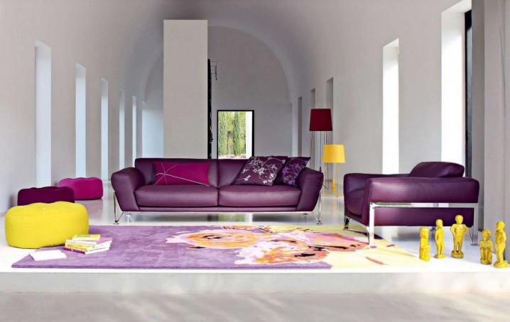 Comfortable-Family-Space-With-Purple-Sofas-Purple-Cushions-Purple-Roche-Bobois-Carpet-And-The-White-Wall