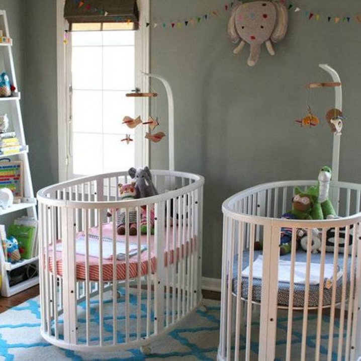 unisex-twin-baby-bedrooms-with-two-white-cribs-and-ladder-and-toys