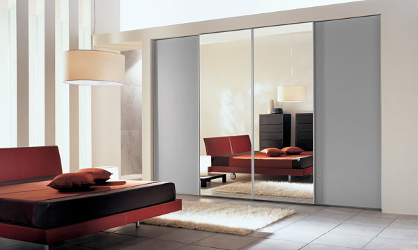 small-space-master-bedroom-complete-with-sliding-mirror-closet-doors-Sliding-doors-in-a-sleek-bedroom