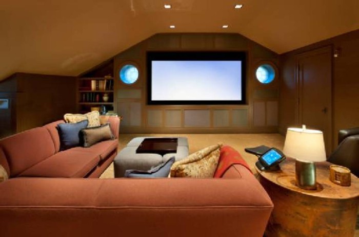 attic-home-theater-with-coral-sectional-sofa-700x461