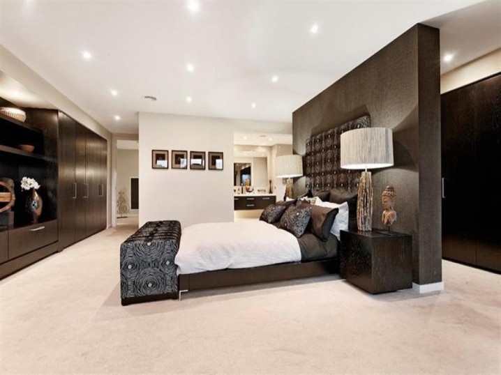 elegant-bedroom-design-wrap-in-luxury-furnished-with-a-platform-bed-stylish-soft-bench-and-large-wardrobe