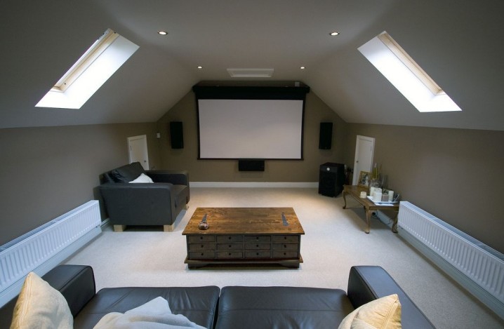 simple-attic-home-theater-idea-with-classy-coffee-table-decor