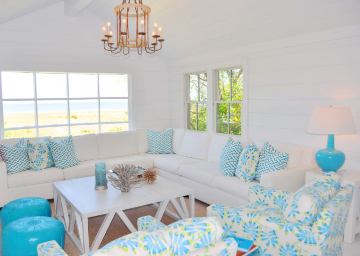 cococozy lynn morgan design nantucket cottage living room turquoise white green sectional moroccan poufs stools