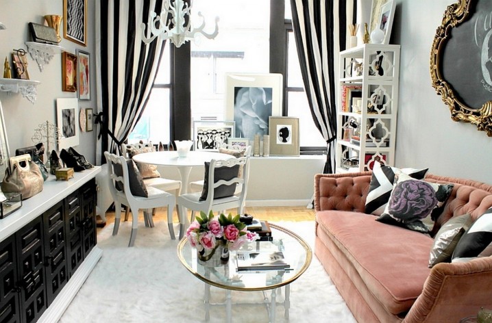 Feminine-living-room-in-black-and-white-striped-drapes-and-ultra-modern-cabinet-also-pop-of-pink-tufted-couch