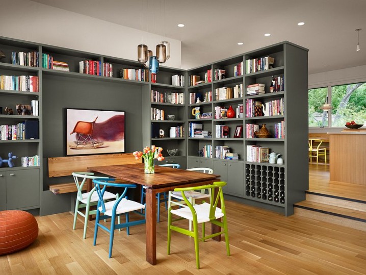 Colorful-collection-of-wishbone-chairs-and-gorgeous-gray-bookshelves-add-to-the-charm-of-this-dining-room