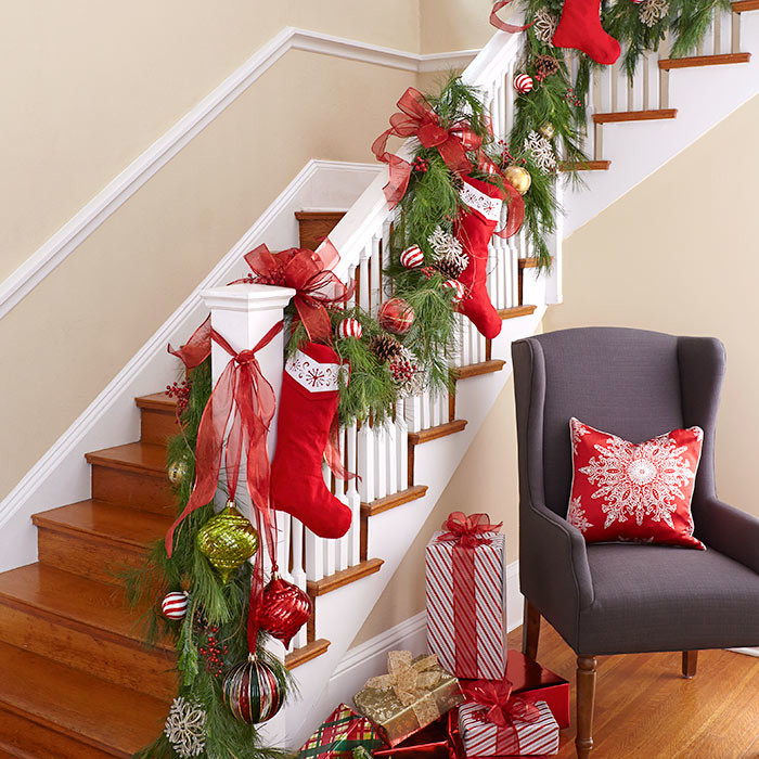 c03f4__Family-stockings-and-Christmas-ornaments-turn-the-staircase-into-a-focal-point