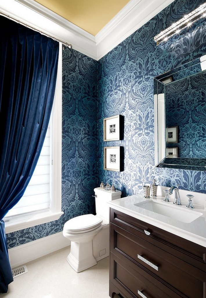 elegant-powder-room-design-with-Rich-blue-damask-wallpaper-coupled-with-silk-drapes-and-wooden-vanity-also-silver-accent-on-the-mirror