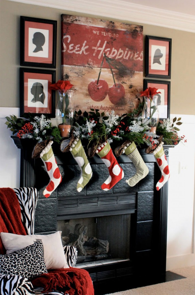 gorgeous-christmas-decoration-on-fireplace-mantel-with-five-christmas-shockings-two-transparent-flower-vases-and-red-green-white-plants-ornaments