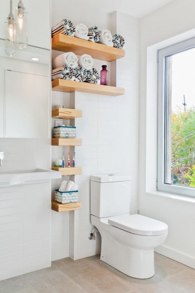 monochromatic-white-bathroom-set-with-creative-mini-wooden-floating-shelving-over-toilet-decor-834x1251