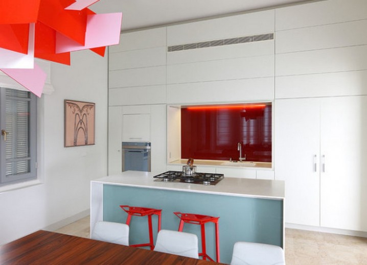 Colorful-vivid-modern-kitchen-interior-design-with-Big-Bang-Chandelier-by-Foscarini-and-white-sleek-kitchen-island-cabinet-also-bright-orange-kitchen-stools