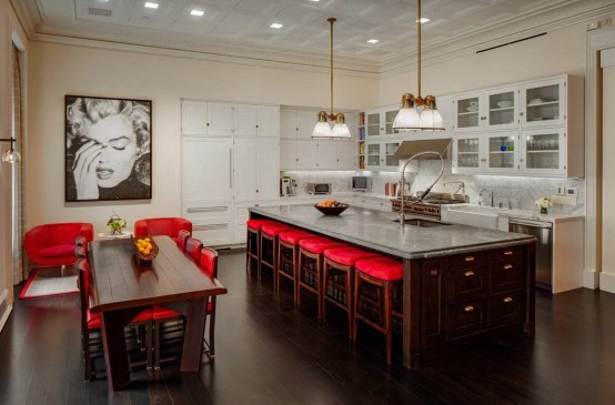 Excellent-Luxurious-Penthouse-With-Bright-Red-Accents-with-chandelier-kitchen-island-dining-table-chair