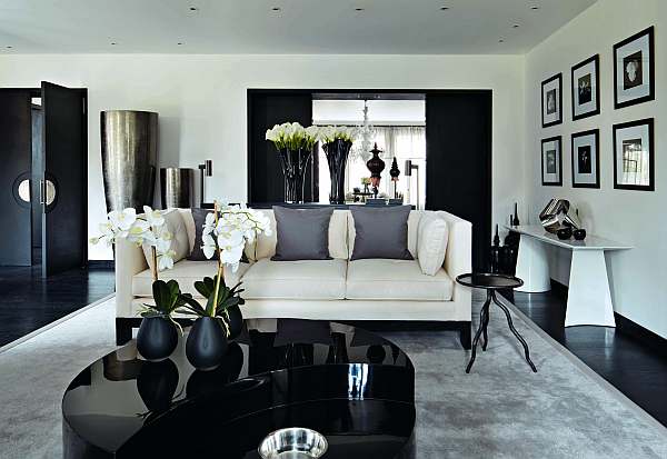 Black-and-white-living-room-with-glossy-coffee-table-and-comfy-rug