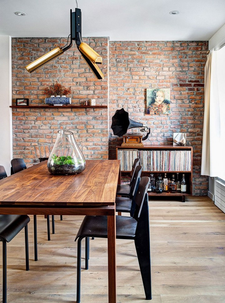 Industrail-elements-shape-the-renovated-dining-space-with-brick-walls