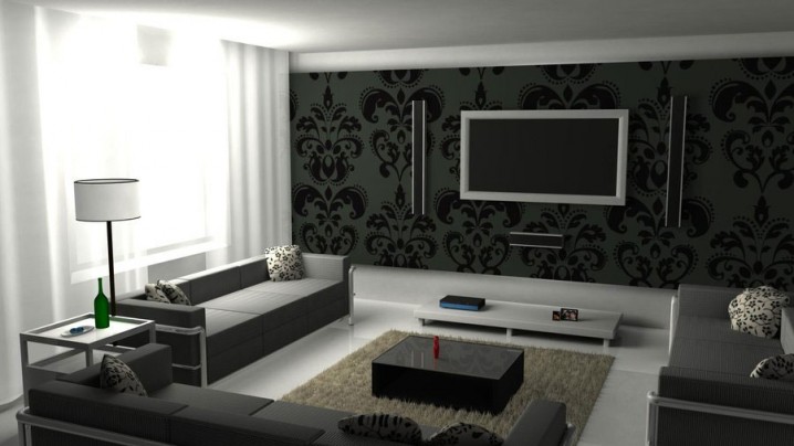 black-and-white-living-room-ideas-with-black-sofas-and-floral-pillows-then-rectangular-table-on-rug-also-tv-wall-unit-as-well-as-wall-decal