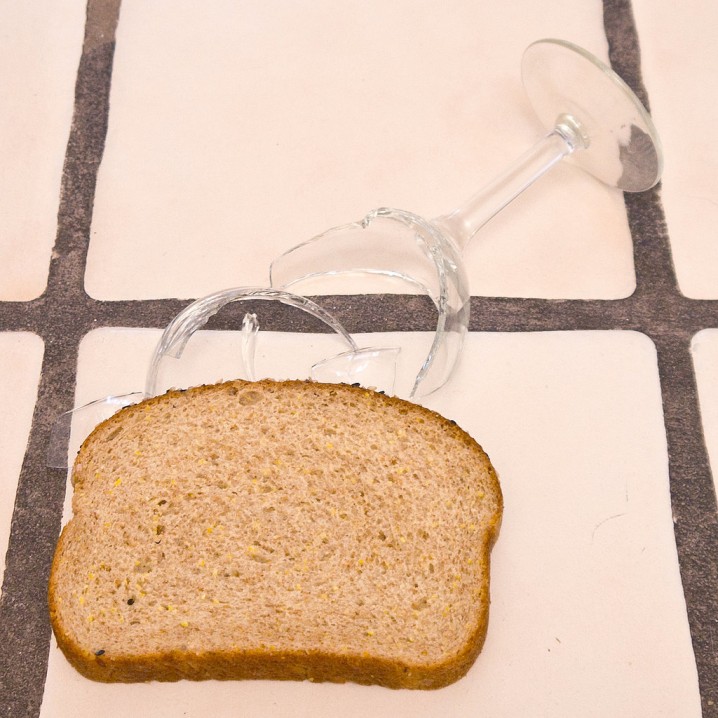 pick up broken glass with a slice of bread