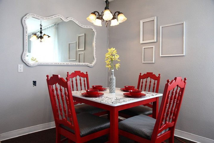 An-infusion-of-red-for-the-dining-room-with-empty-frames-on-the-wall