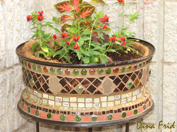 old wheel mosaic flower pot