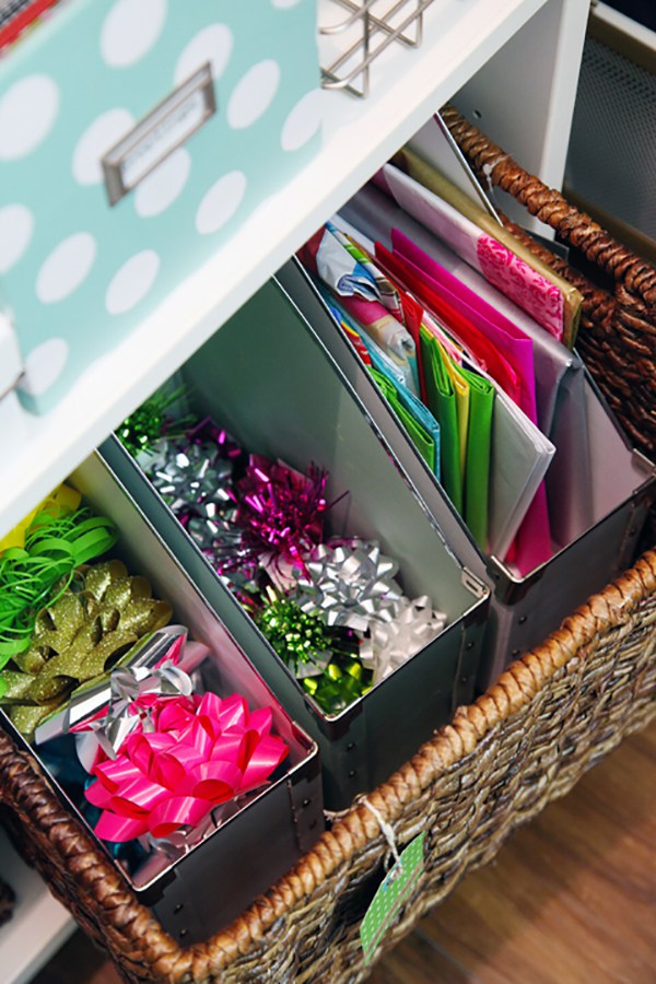 Organising-paper-and-bows-with-magazine-files-in-large-wicker-basket