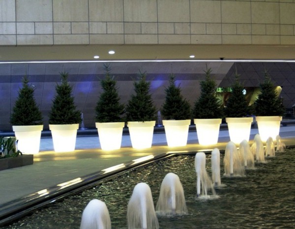 many-flower-pots-lit-up-in-white