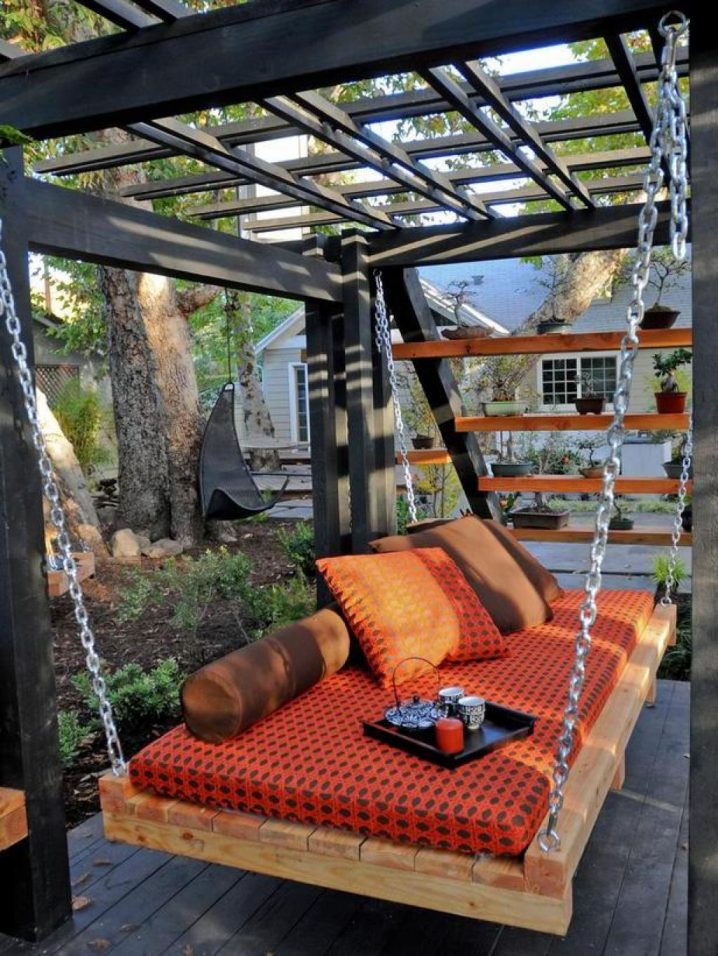 Asian-Outdoor-Daybed-with-orange-color-cover-as-comfortable-place-at-the-midle-of-garden