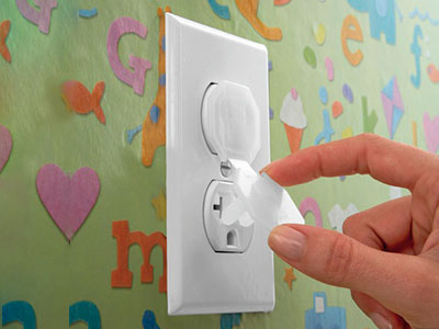 Baby-proofing-an-electrical-outlet-with-safety-caps