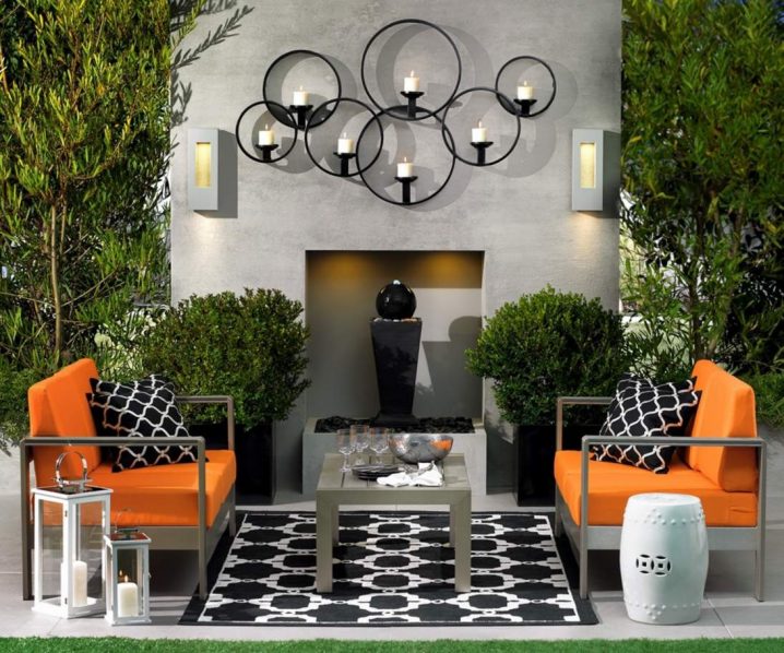Prodigious-Candle-Holders-Design-Above-Fireplace-and-Orange-Chairs-in-Patio-Decorating-Ideas