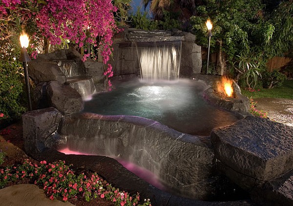 garden-design-with-torches-outdoor-pool-waterfall