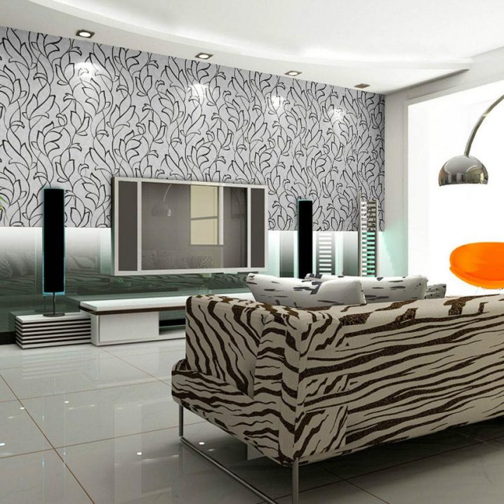 Uniqe-and-Modern-Living-Room-with-black-and-white-floral-modern-wallpaper-for-walls-and-cozy-sofa-with-zebra-pattern-facing-tv-sets-and-white-ceramic-flooring