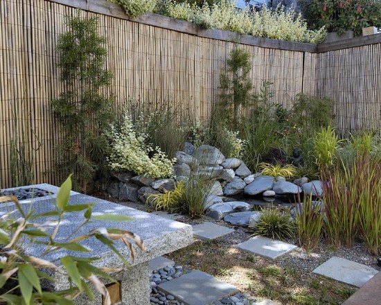 Japanese-style-garden-privacy-bamboo-fence-plants-stone-concrete-garden-table