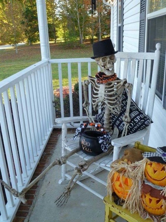 02-spooky-skeleton-on-your-porch-with-a-cauldron-with-sweets