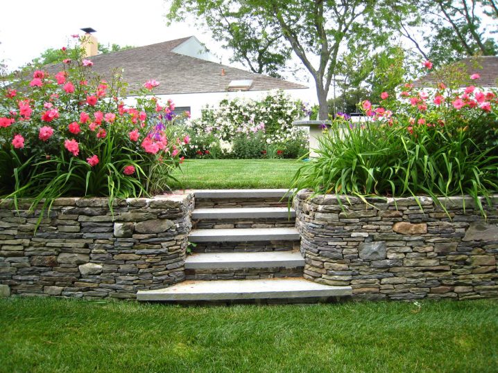 unique-landscape-design-ideas-with-outdoor-staircase-from-stone-material-under-pink-flower