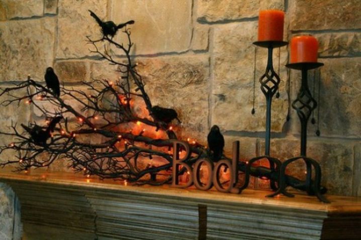 halloween-decoration-idea-for-mantel-with-orange-candles-with-black-candle-holders-and-black-tree-branches-with-black-birds-fantastic-halloween-decoration-ideas