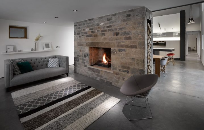 historic-barn-reinvented-modern-home-exposed-trusses-7-fireplace