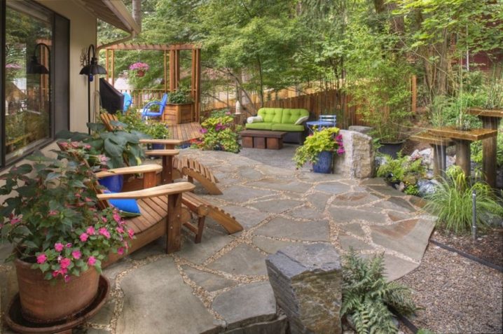 rustic-garden-container-plantings-garden-decor-adirondack-chairs-flagstone-water-feature-gregg-and-ellis-landscape-designs_3921